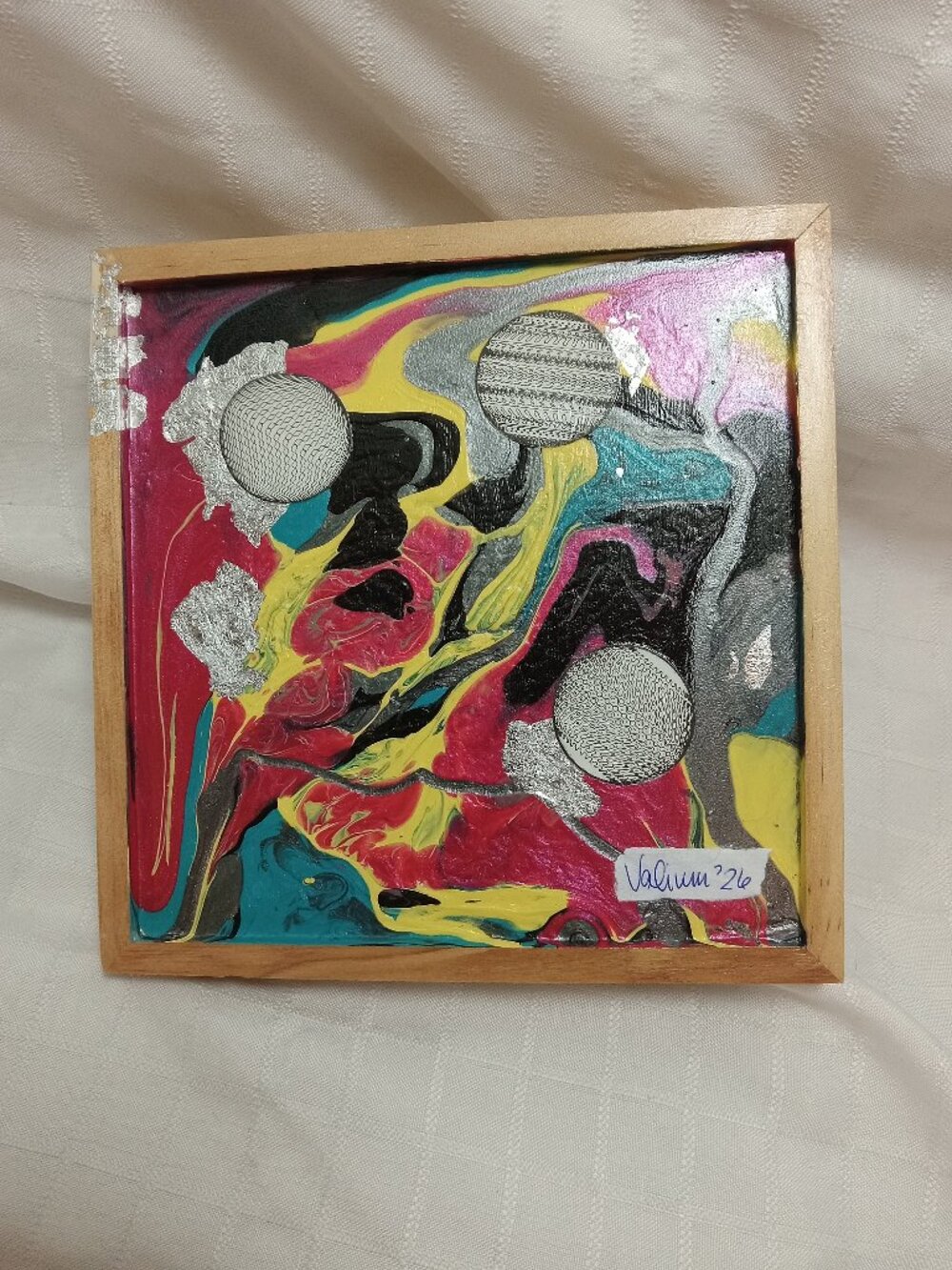 Collage on a liquid art panel, mixted media acrylic with silver foil